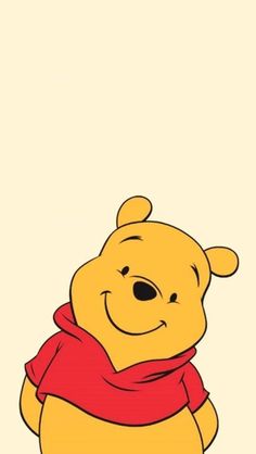 winnie the pooh is sitting down with a scarf around his neck and wearing a red scarf