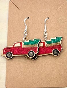 Lightweight Wood Red Truck Christmas Earrings These earrings are made from a lightweight wood cut by a laser engraver. Earrings are colored by hand. Christmas earrings have a green tree in a red truck. Made with lead and nickel free hooks. Red Truck Christmas, Wood Cut, Green Tree, Red Truck, Christmas Earrings, Green Trees, Halloween Shopping, Jewelry Earrings Dangle, Etsy Earrings