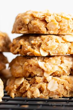 a stack of oatmeal cookies sitting on top of a cooling rack