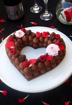 a heart shaped cake sitting on top of a white plate