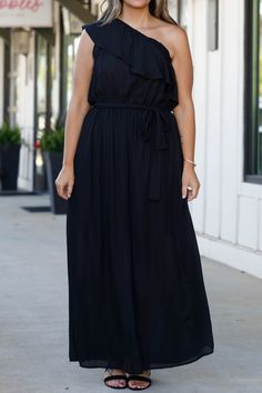 You'll look so fierce in this gorgeous dress! This dress has a beautiful black color with a flirty length and sleek material! This dress is perfect for any occasion, whether it is a plus on to a wedding or a fun holiday party! Style this dress with cute accessories and heels for a classy chic look! 100% Polyester Black Summer Maxi Dress For Prom, Black Maxi Dress For Summer Prom, Chic Solid Maxi Dress With Flattering Silhouette, Flowy Dresses For A Night Out, Black Maxi Dress With Flattering Silhouette, Flowy Dressy Maxi Dress For Date Night, Black Sleeveless Maxi Dress For Bridesmaids, Black Sleeveless Maxi Bridesmaid Dress, Black Midi Dress With Flattering Silhouette