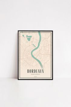 a framed map of bordeaux, france with the name and shape of the city on it