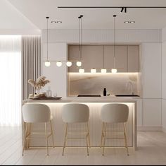 a modern kitchen with three bar stools