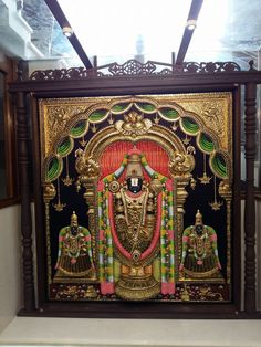 an ornately decorated painting on display in a room