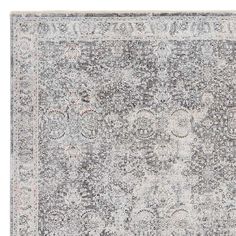 an area rug with grey and white colors