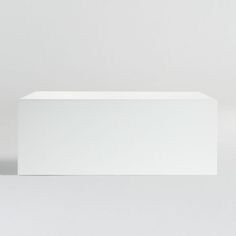 an empty white box sitting on top of a table