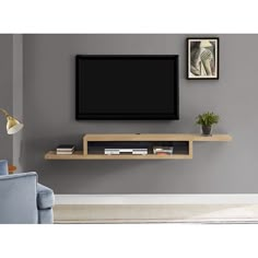 a flat screen tv mounted to the side of a wall