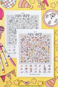 two new york city coloring pages with markers and pencils next to them on a yellow background