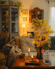 a living room filled with furniture and a lit candle