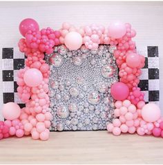 an image of balloons on the wall and in front of a photo frame that looks like it is made out of balls