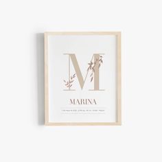 the letter m is for marina in gold foil on a white background with an olive branch