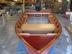 a wooden boat being built in a shop