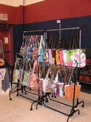 the display is full of handbags and purses for sale at pop fair 106109