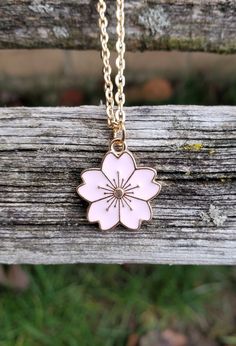 This cute little Sakura flower (cherry blossom) necklace would make a great gift. You can choose between 5 colors: pink, red, white, turquoise, and black. The flower measures 5/8 inch wide. You can choose the length and color of your necklace at checkout. This would make a great gift for a bridesmaid or a birthday, an anniversary or Christmas. All jewelry items come in a gift box. Cute Flower Jewelry For Valentine's Day, Cute Flower Pendant Jewelry For Gifts, Cute Flower Pendant Jewelry Gift, Pink Flower Charm Necklace With Flower Pendant, Cute Flower Jewelry For Gifts, Pink Flower Necklace For Birthday Gift, Cute Flower-shaped Jewelry Gift, Cute Rose Gold Flower Jewelry, Cute Flower Shaped Jewelry For Mother's Day