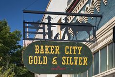 a sign that says baker city gold and silver