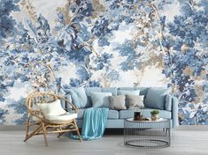 a living room with blue and white wallpaper, a couch, chair and coffee table