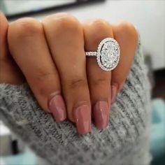 a woman's hand with a ring on it