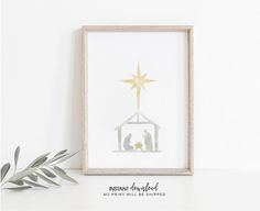 a framed nativity scene with the birth of jesus and baby jesus in a manger