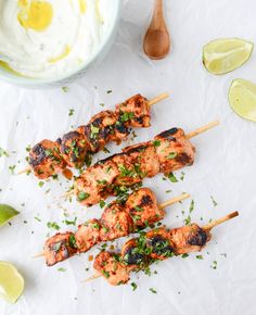 grilled chicken skewers with cilantro and parsley garnish