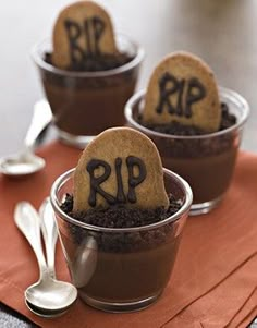 two desserts with chocolate frosting and cookies in small cups on top of each other