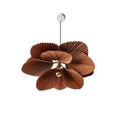 a brown flower shaped light hanging from a ceiling