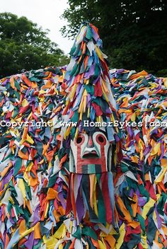 a bird house made out of colorful streamers