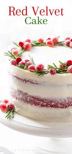 a red velvet cake with white frosting and cranberries