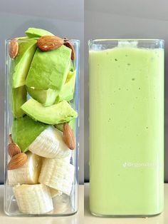 a glass filled with green liquid next to a container full of bananas and almonds