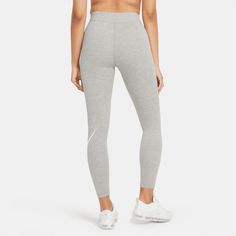 Style No. CZ8528-063 Color: Dark Heather Grey/White The perfect complement to your favorite tops and tees, the Nike Sportswear Leggings have a high-rise design and a stretchy waistband that sits above your navel. The soft, cotton blend wicks sweat, making these full-length leggings an easy choice for everyday wear. Tight fit for a body-hugging feel. 61% cotton/33% polyester/6% spandex. Nike Sportswear Essential Women's High-Waisted Logo Leggings. Sportswear Logo, Logo Jersey, Sportswear Leggings, Leggings Nike, Nike Leggings, Heather White, Women Essentials, Nike Sports, High Rise Leggings