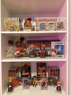 the shelves are filled with anime books and figurines, as well as other toys