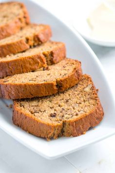 slices of banana bread on a plate with butter