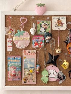 a cork board with various items hanging on it