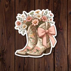 Add a touch of rustic charm to your belongings with our cute pastel cowboy boots vinyl sticker! This water-resistant die-cut sticker features beautifully detailed cowboy boots adorned with wildflowers sprouting from the top and a delicate pink bow. Perfect for decorating laptops, water bottles, journals, and more, this sticker combines durability with a whimsical design. Made from high-quality vinyl, it withstands the elements while adding a pop of soft, pastel color and personality to your item Country And Western, Cute Country, Pink Coquette, Cute N Country, Whimsical Design, Coquette Bow, Cow Boy, Mail Letters, Pink Bow