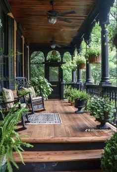 a porch with chairs and plants on it