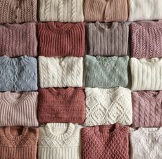 many different sweaters are arranged in rows