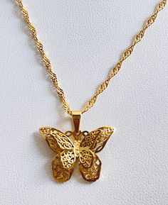 Beauty of nature and the elegance of gold with our 18K Gold Butterfly Pendant Necklace. Elevate your style, celebrate life's moments, and embrace the grace of the butterfly with this captivating and unforgettable piece. Its clean lines and graceful form make it a versatile piece that effortlessly complements a range of styles, from understated elegance to modern chic.- 40cm + 5cm =45cm total length- 18k gold filled - glossy gold finish★- on vintage gold side★- lobster claw closure- tarnish resis Luxury Gold Jewelry With Butterfly Charm, Elegant Butterfly Jewelry As A Gift For Her, Elegant Butterfly Jewelry Gift For Her, Elegant Yellow Gold Butterfly Jewelry, Elegant Gold Plated Butterfly Necklaces, Elegant Gold Plated Necklace With Butterfly Charm, Dainty Gold-plated Yellow Gold Butterfly Necklace, Elegant Gold-plated Necklace With Butterfly Charm, Butterfly Shaped Filigree Jewelry Gift