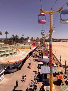 an overhead view of a carnival with people walking around