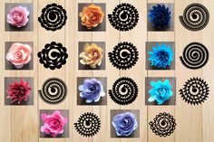 several different types of paper flowers on a wooden surface