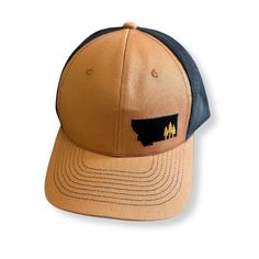 Montana Scene Tree Trucker - Camel - The Montana Scene Trucker Snapback Hat With Curved Bill For Travel, Spring Outdoor Snapback Hat With Curved Bill, Outdoor Spring Snapback Hat With Curved Bill, Curved Bill Snapback Hat For Spring Outdoor, Trucker Snapback Hat For Travel, Snapback Trucker Hat For Travel, Brown Trucker Baseball Cap For Camping, Spring Outdoor Trucker Hat With Flat Bill, Trucker Style Brown Baseball Cap For Camping