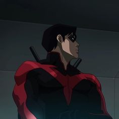 a man in a red and black suit with two swords on his shoulder, looking off to the side