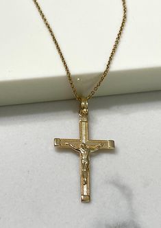 Item Specifications Handmade Yellow Gold A timeless symbol of faith and redemption. This crucifix cross is beautifully crafted in 14k yellow gold.  Whether for a baptism, confirmation, wedding, or as a thoughtful gesture of sympathy and support, our crucifix cross makes a meaningful and cherished gift for loved ones.  Cross Measurements : 31mm (With Bail) Height x 16.50mm Width Metal : 14k yellow gold Chain Style: 0.90mm Cable 18" Long Closure: Spring Ring Country Of Manufacturing------------- *USA Michigan* Shop at Gabriana Jewelers with confidence. We've been in jewelry making business for over 35 years.Each and every one of our items are made with special care by a skilled professional, and we guarantee all our customers satisfaction. Customers would come to us with very rough ideas ,ev Jewelry Making Business, Cross Jesus, Country Rings, Timeless Symbol, Cross Chain, Luxury Gift Box, Jesus On The Cross, Yellow Gold Chain, Jewelry Manufacturers