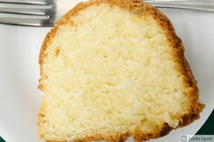 a piece of cake sitting on top of a white plate next to a knife and fork