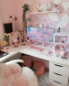 a white desk topped with a computer monitor and keyboard