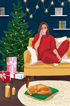 a woman sitting on a couch drinking from a cup in front of a christmas tree