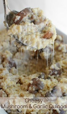 a spoonful of cheesey mushroom and garlic quinoa casserole on a white plate