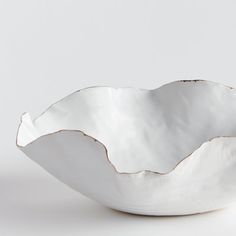 a white bowl sitting on top of a table