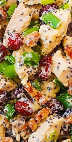 a salad with chicken, broccoli and cranberries