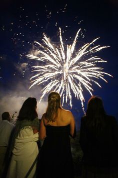 two women looking at fireworks in the sky