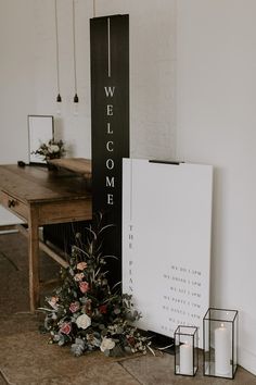 Tall vertical black and white wedding welcome sign with black and white order of the day sign surrounded by pink wedding flowers Black And White Wedding Signage, Black And White Signage, Black Wedding Sign, White Wedding Welcome Sign, Black And White Wedding Reception, Pink Wedding Sign, Order Of The Day Sign, Rustic Wedding Signage, Wedding Entrance Sign