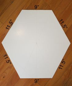 the pattern is cut out to make a hexagonal table top with numbers on it